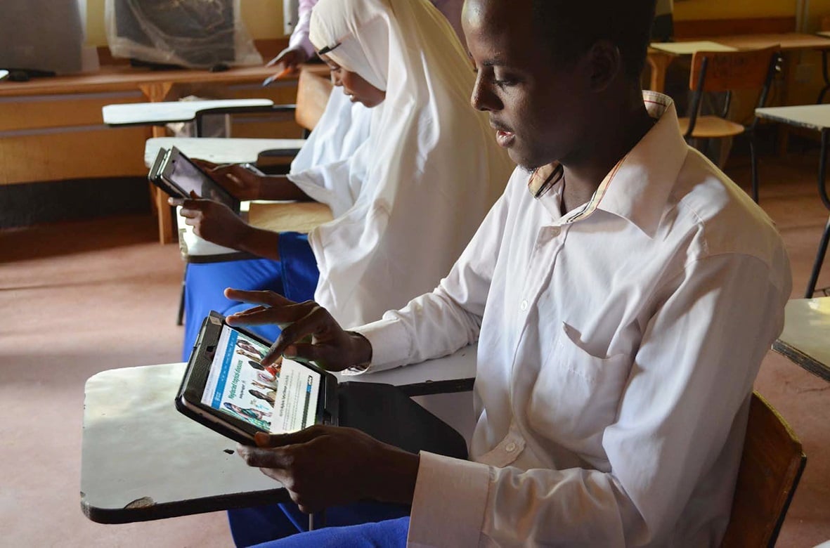 Students use tablets to study NTD online courses in Dadaab, Kenya.